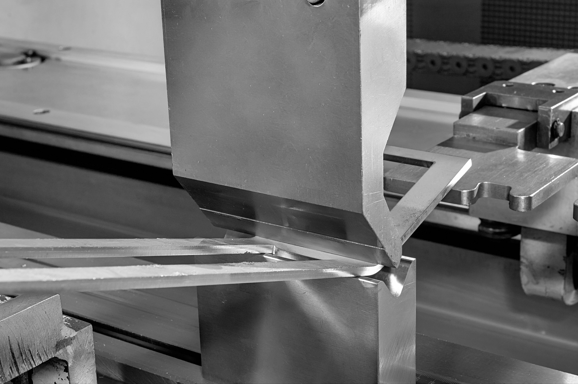 operator bending metal sheet by sheet bending machine